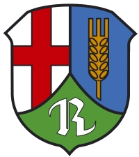 Das Wappen von Rüber ist gespalten durch eine eingeschweifte, gekürzte grüne Spitze, darin ein silbernes „R“; vorne in Silber ein rotes Balkenkreuz, hinten in Blau eine goldene Ähre.